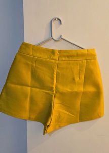 High-Waisted Yellow Shorts with Chain Detail