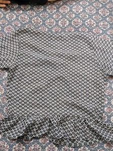 Black symmetrical designed top with full sleeves