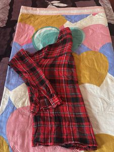 Red and black plaid flannel shirt.