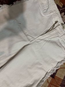 Stylish White Jeans with Fringed Accents