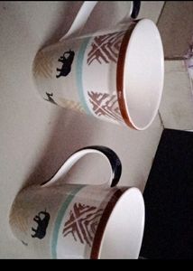 A PAIR OF ELEPHANT DESIGNED MUGS NEW