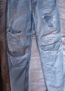 Distressed Light Wash Denim Jeans