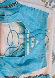 Cream Saree with Blue Embroidery blouse