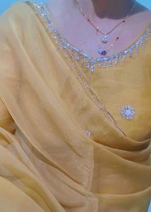 Elegant Golden Saree with Floral Embroidery
