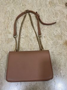 beige sling bag