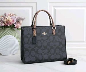 COACH**12A QUALITY HANDBAG* AT OFFER PRICE