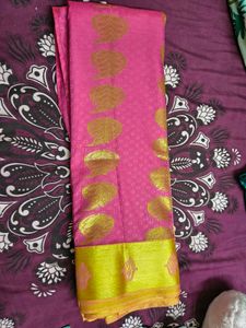 Vibrant Pink Saree with Golden Motifs