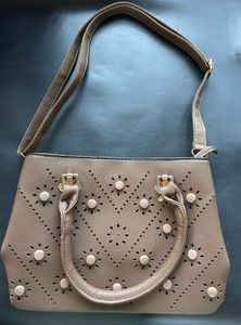 Stylish Taupe Handbag with Perforated Design