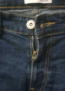Distressed Blue Denim Jeans