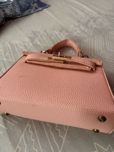 Chic Pink Textured Handbag