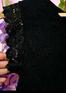 Elegant Black Lace Dress with Red Floral Detail