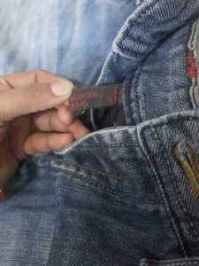 Distressed Blue Denim Jeans
