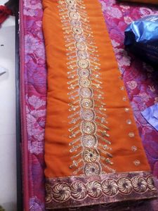 Elegant Orange Embroidered Saree