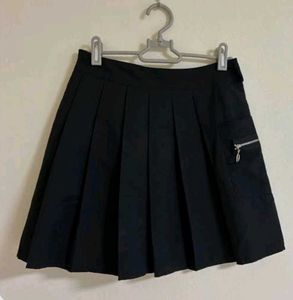 Classic black pleated mini skirt.