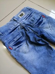 Distressed Blue Denim Jeans