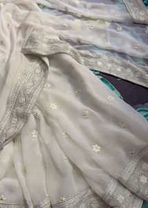 Elegant White Saree with Silver Embellishments