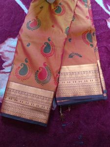Elegant Peach Saree with Peacock Motif
