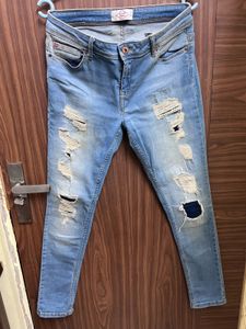 Distressed Light Wash Denim Jeans