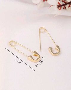 Women Safety Pin Design Golden Studs Earrings
