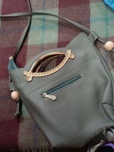Stylish Grey Handbag with Embellishments