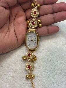 Elegant Gold Watch with Red & Crystal Accents