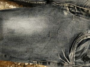 Distressed Blue Denim Jeans