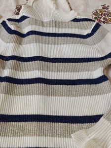 Striped Turtleneck Sweater with Ruffle Trim
