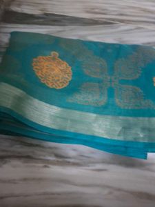 Beautiful Teal Saree with Golden Motifs
