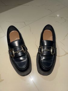 Chic Black Loafers with Gold Bit Detail