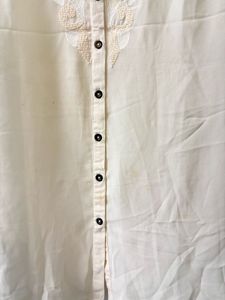 Elegant Cream Embroidered Sleeveless Blouse