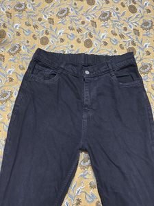 Edgy black flared jeans with side slits&amp;frayed hem