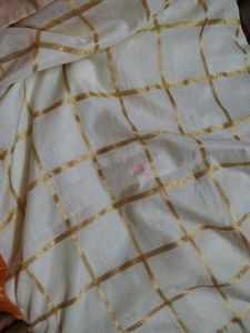 Cream saree with orange blouse
