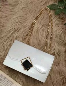 26.Chic White Clutch with Gold Chain