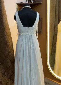 Elegant White Gown with Pearl Necklace
