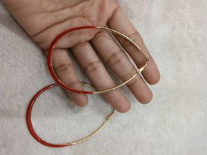 Chic Hoop Earrings with Red Accent