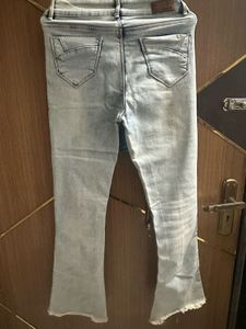 Light Wash Flared Jeans with Zipper Detail