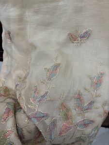 an elegant, cream-toned traditional Indian Kurta