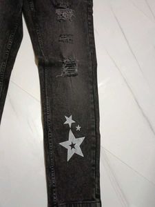Distressed Black Jeans with Star Detail