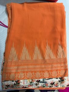 Elegant Orange Saree with Floral Border