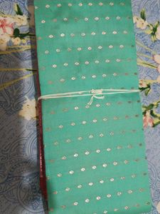Elegant Teal Saree with Silver Motifs