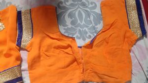 Orange Saree with Blue Velvet Blouse