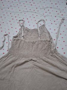 sleeveless dress over jeans top