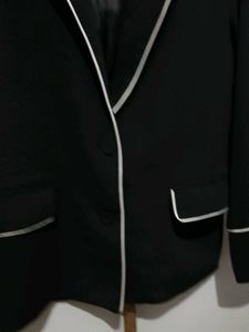 Chic Black Blazer with White Piping
