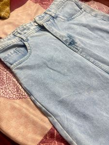 This is a light-wash denim midi skirt
