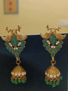 Peacock jhumka with golden bangles
