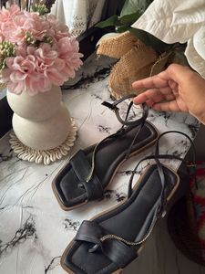 Chic Black Flat Sandals with Gold Chain Detail