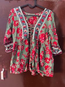 red and green floral top