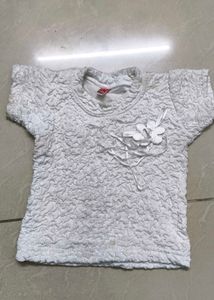 Cute White Textured Top with Flower Accent