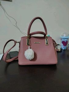 Stylish Pink Textured Handbag with Charm