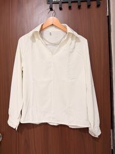Elegant White Collared Blouse with Pearl Necklace
